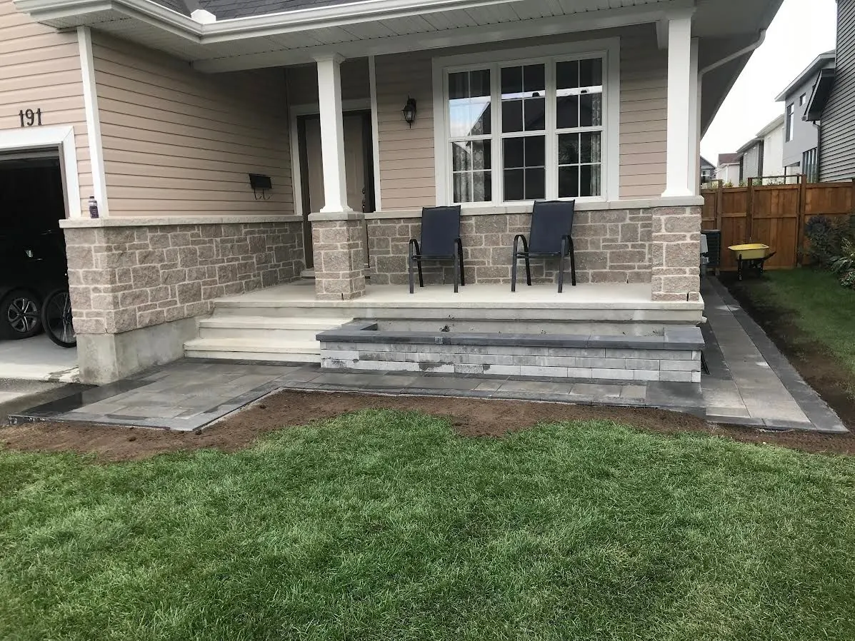 Stone porch steps and landing at a home's front entry