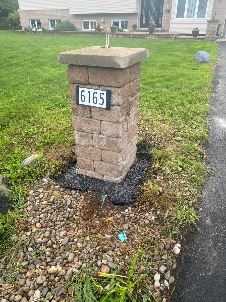 Stone pillar built at a driveway entrance
